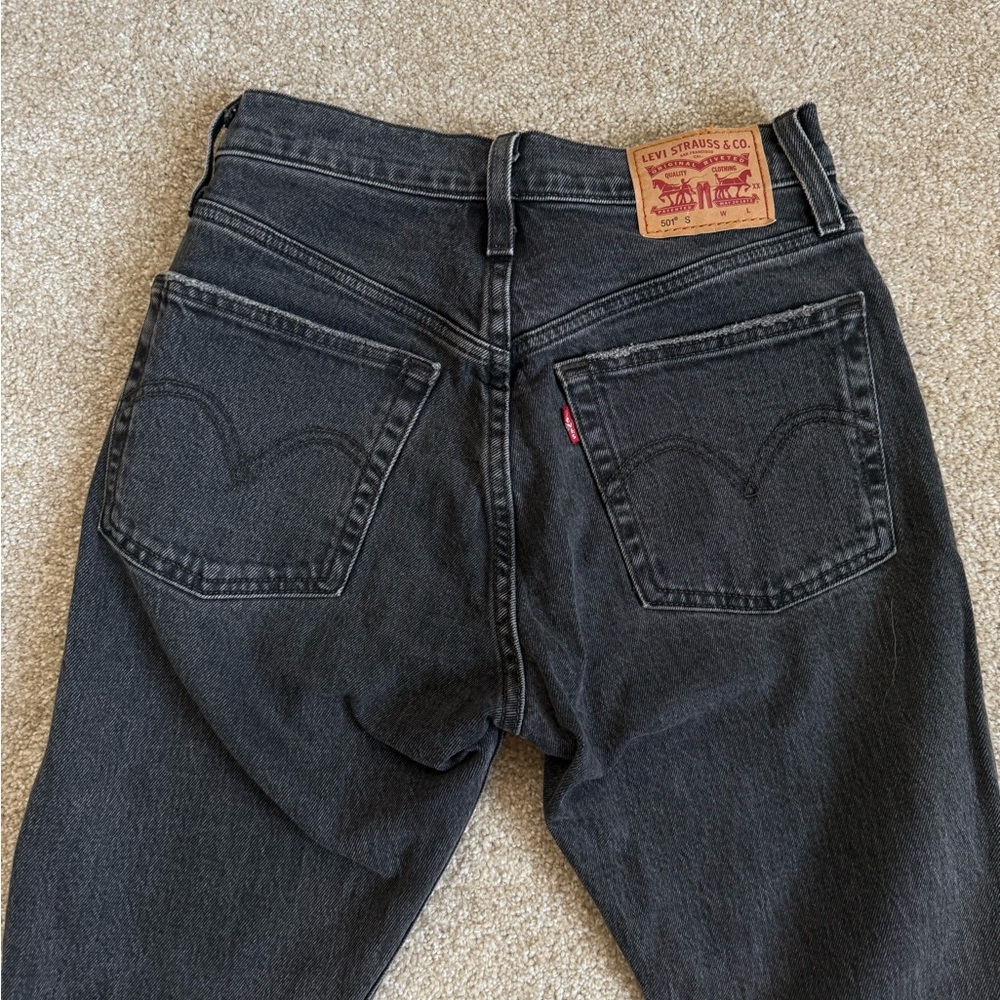 Levi’s women’s distressed black 501 jeans